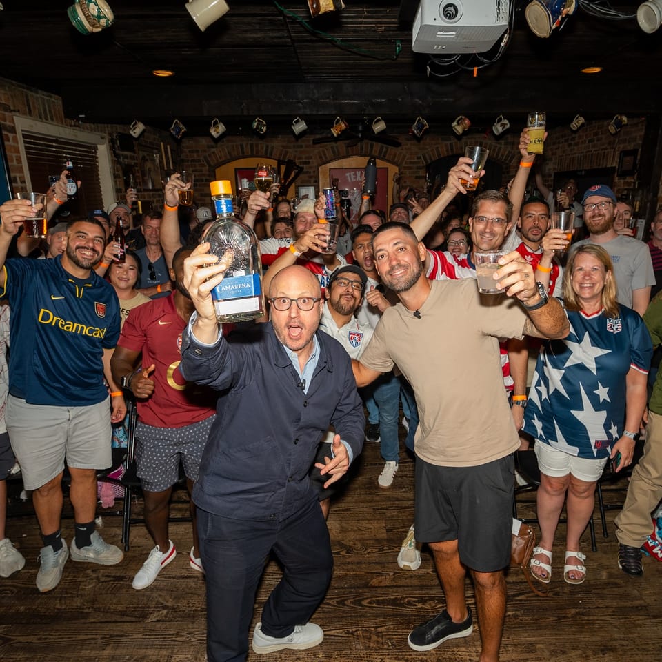 Supporters celebrating at The Londoner Addison